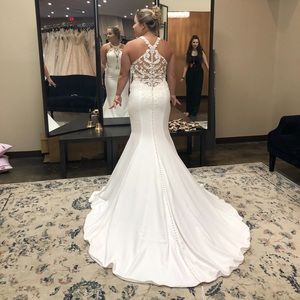 Size 12 wedding dress. Never worn besides trying on. Paid 1800.